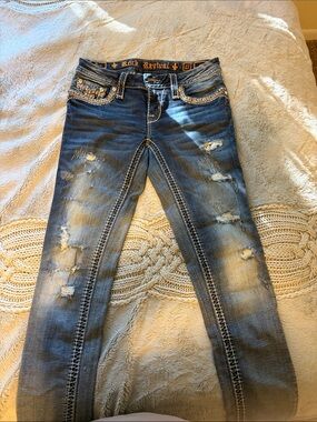 Rock Revival Women's Distressed Dark Blue Skinny Jeans with Embellished Pockets
